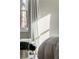 Bright bedroom featuring a cozy reading nook by the window with draped curtains at 4568 Oswood Ct, Tucker, GA 30084