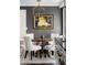 Cozy dining area showcasing a round wooden table with upholstered chairs and modern pendant lighting at 4568 Oswood Ct, Tucker, GA 30084
