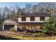 Charming two-story home boasts stone accents, a cozy front porch, and an attached garage at 4568 Oswood Ct, Tucker, GA 30084