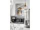 Kitchen detail showcasing stainless steel appliances, white cabinets, and stylish backsplash tiles at 4568 Oswood Ct, Tucker, GA 30084