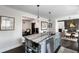 Bright kitchen with a marble countertop island, stainless steel appliances, and pendant lighting at 4568 Oswood Ct, Tucker, GA 30084