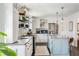 Bright, modern kitchen with stainless steel appliances, a center island, and stylish pendant lighting at 4568 Oswood Ct, Tucker, GA 30084