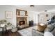 Cozy living room with a stone fireplace, hardwood floors, and natural light at 4568 Oswood Ct, Tucker, GA 30084