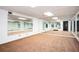 Spacious carpeted basement with mirrored walls at 5102 Chastleton Dr, Stone Mountain, GA 30087