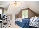 Bedroom featuring bed and desk space, with french doors to a back deck at 5102 Chastleton Dr, Stone Mountain, GA 30087