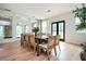 Bright dining room with a large wooden table and ample natural light at 5102 Chastleton Dr, Stone Mountain, GA 30087