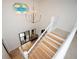 Bright foyer with chandelier, staircase with wooden treads, and a herringbone-patterned floor at 5102 Chastleton Dr, Stone Mountain, GA 30087