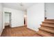 Upstairs hallway with carpeted floors and stairs at 5102 Chastleton Dr, Stone Mountain, GA 30087