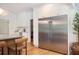 Gourmet kitchen with stainless steel refrigerator and custom cabinets at 5102 Chastleton Dr, Stone Mountain, GA 30087