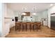 Spacious kitchen features a large island with bar seating and pendant lighting at 5102 Chastleton Dr, Stone Mountain, GA 30087