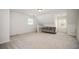 Living room with a couch, carpet flooring, and natural light from two windows at 5102 Chastleton Dr, Stone Mountain, GA 30087