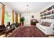 Expansive living room with natural light, hardwood floors, and vintage decor, perfect for entertaining and relaxing at 5102 Chastleton Dr, Stone Mountain, GA 30087