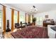 Large living room boasts hardwood floors, abundant natural light, and a cozy atmosphere, perfect for relaxation at 5102 Chastleton Dr, Stone Mountain, GA 30087