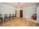Well-lit living room with hardwood floors, natural light, and neutral decor, providing a blank canvas for personal style at 5102 Chastleton Dr, Stone Mountain, GA 30087