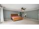 Spacious bedroom featuring carpet, ceiling fan and natural lighting from surrounding windows at 5102 Chastleton Dr, Stone Mountain, GA 30087