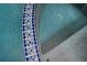 Intricate blue tile detailing complements the cool, refreshing waters of this inviting residential pool at 5102 Chastleton Dr, Stone Mountain, GA 30087