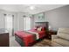 Cozy bedroom with natural light, ceiling fan, and neutral paint at 5880 Crestwick Way, Cumming, GA 30040