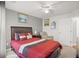 Nicely decorated bedroom with natural light, ceiling fan, and neutral paint at 5880 Crestwick Way, Cumming, GA 30040