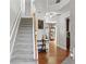 Entry way featuring staircase and access to multiple rooms at 5880 Crestwick Way, Cumming, GA 30040