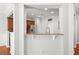 View of a modern kitchen with a pass-through counter and open design at 5880 Crestwick Way, Cumming, GA 30040