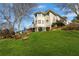 Landscaped backyard view highlighting the home's back exterior on an elevated lot and private setting at 2502 Oak Hill Ovlk, Duluth, GA 30097