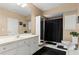 Bright bathroom with modern fixtures, white tile, and ample storage space at 2502 Oak Hill Ovlk, Duluth, GA 30097