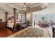 Spacious main bedroom with hardwood floors, a sitting area, and ample natural light at 2502 Oak Hill Ovlk, Duluth, GA 30097