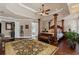 Spacious main bedroom with hardwood floors, a seating area, and ample natural light at 2502 Oak Hill Ovlk, Duluth, GA 30097