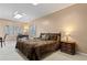 Bedroom featuring a bed, bedside table, and windows with shutters at 2502 Oak Hill Ovlk, Duluth, GA 30097
