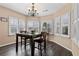 Bright dining area with wood floors, large windows, and chandelier lighting at 2502 Oak Hill Ovlk, Duluth, GA 30097