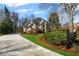 Charming home featuring a manicured lawn, mature landscaping, and a private driveway, offering curb appeal at 2502 Oak Hill Ovlk, Duluth, GA 30097