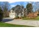 A well kept home with three garage spaces and manicured lawn, offering a blend of functionality and curb appeal at 2502 Oak Hill Ovlk, Duluth, GA 30097