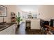 View of the kitchen area, connected to a breakfast nook with natural light at 2502 Oak Hill Ovlk, Duluth, GA 30097