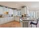 Bright kitchen featuring white cabinets, tile floors, granite countertops and stainless steel appliances at 2502 Oak Hill Ovlk, Duluth, GA 30097