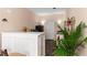 Small kitchenette with a white breakfast bar, refrigerator, and sink at 2502 Oak Hill Ovlk, Duluth, GA 30097