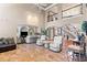 Spacious living room featuring custom built-in shelves, large windows, and access to an elegant staircase at 2502 Oak Hill Ovlk, Duluth, GA 30097