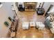 Open living room featuring tile flooring, a fireplace, and abundant seating at 2502 Oak Hill Ovlk, Duluth, GA 30097