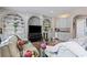Cozy living room featuring custom built-in shelving, a wet bar, and comfortable seating at 2502 Oak Hill Ovlk, Duluth, GA 30097