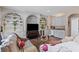 Cozy living room featuring custom built-in shelving, a wet bar, and comfortable seating at 2502 Oak Hill Ovlk, Duluth, GA 30097