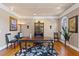 Inviting home office with hardwood floors, built-in shelving, and ample natural light, ideal for productivity at 2502 Oak Hill Ovlk, Duluth, GA 30097