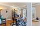Inviting home office with hardwood floors, built-in shelving, and ample natural light, ideal for productivity at 2502 Oak Hill Ovlk, Duluth, GA 30097