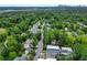 Aerial view of homes, tree-lined streets, and a community baseball field at 395 Pharr Ne Rd # 103, Atlanta, GA 30305