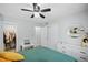 Well-lit bedroom with ceiling fan, vinyl floors, and contemporary decor at 395 Pharr Ne Rd # 103, Atlanta, GA 30305