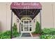 The Barcelona building entrance features covered entryway, attractive exterior lighting, and well-maintained landscaping at 395 Pharr Ne Rd # 103, Atlanta, GA 30305