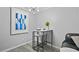 Dining area features modern furniture, white walls, gray flooring, and ample natural light at 395 Pharr Ne Rd # 103, Atlanta, GA 30305
