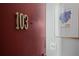 Condo door with unit number, framed artwork, and a clean, minimalist aesthetic at 395 Pharr Ne Rd # 103, Atlanta, GA 30305