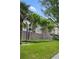 Beautiful multi-story apartment complex with manicured lawn and mature trees at 395 Pharr Ne Rd # 103, Atlanta, GA 30305