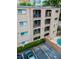 Aerial shot of the building featuring private balconies and a community swimming pool at 395 Pharr Ne Rd # 103, Atlanta, GA 30305