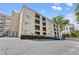 Multi-story building with balconies and ample parking, conveniently located near local amenities at 395 Pharr Ne Rd # 103, Atlanta, GA 30305