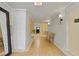 Hallway with neutral wall paint, large mirror, bench, and tile flooring at 395 Pharr Ne Rd # 103, Atlanta, GA 30305